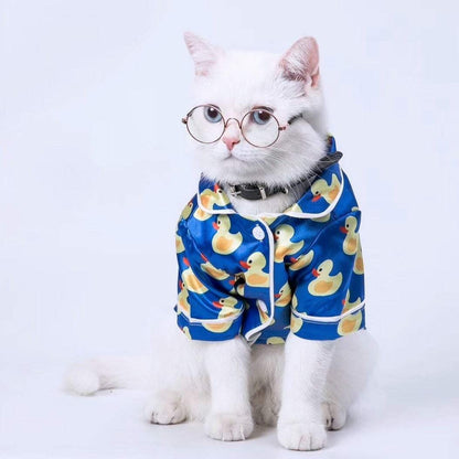French Bulldog wearing soft pet silk duck pajamas with button closure and duck pattern