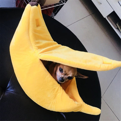 Yellow banana shaped soft plush pet bed with dog inside cozy and warm