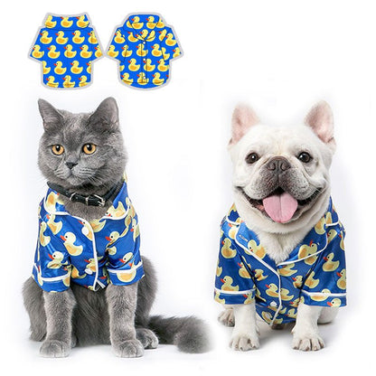 French Bulldog wearing soft pet silk duck pajamas with button closure and duck pattern
