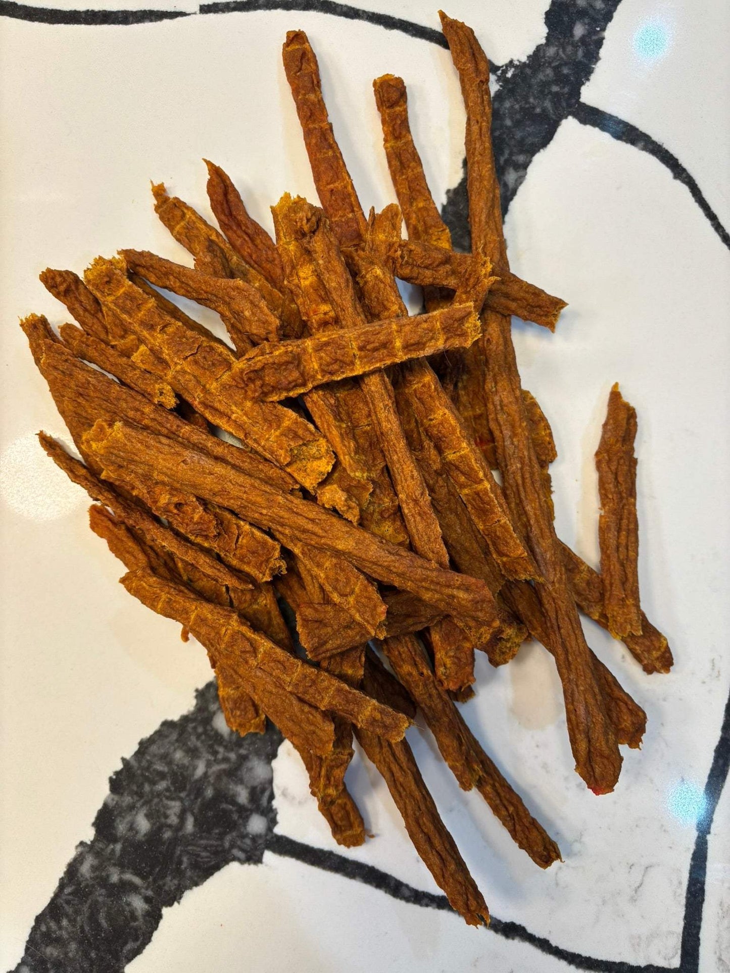 Turkey and Pumpkin Jerky dog treats made with organic pumpkin and human-grade turkey, slow-dehydrated, natural, and preservative-free.