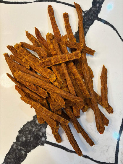 Turkey and Pumpkin Jerky dog treats made with organic pumpkin and human-grade turkey, slow-dehydrated, natural, and preservative-free.