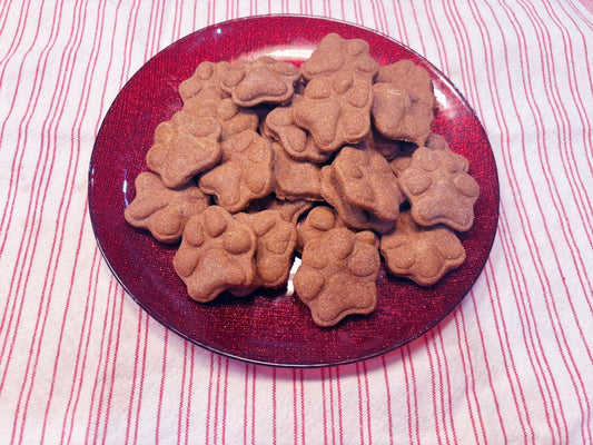 Sweet Potato Paws organic dog treats shaped like paws on a red plate