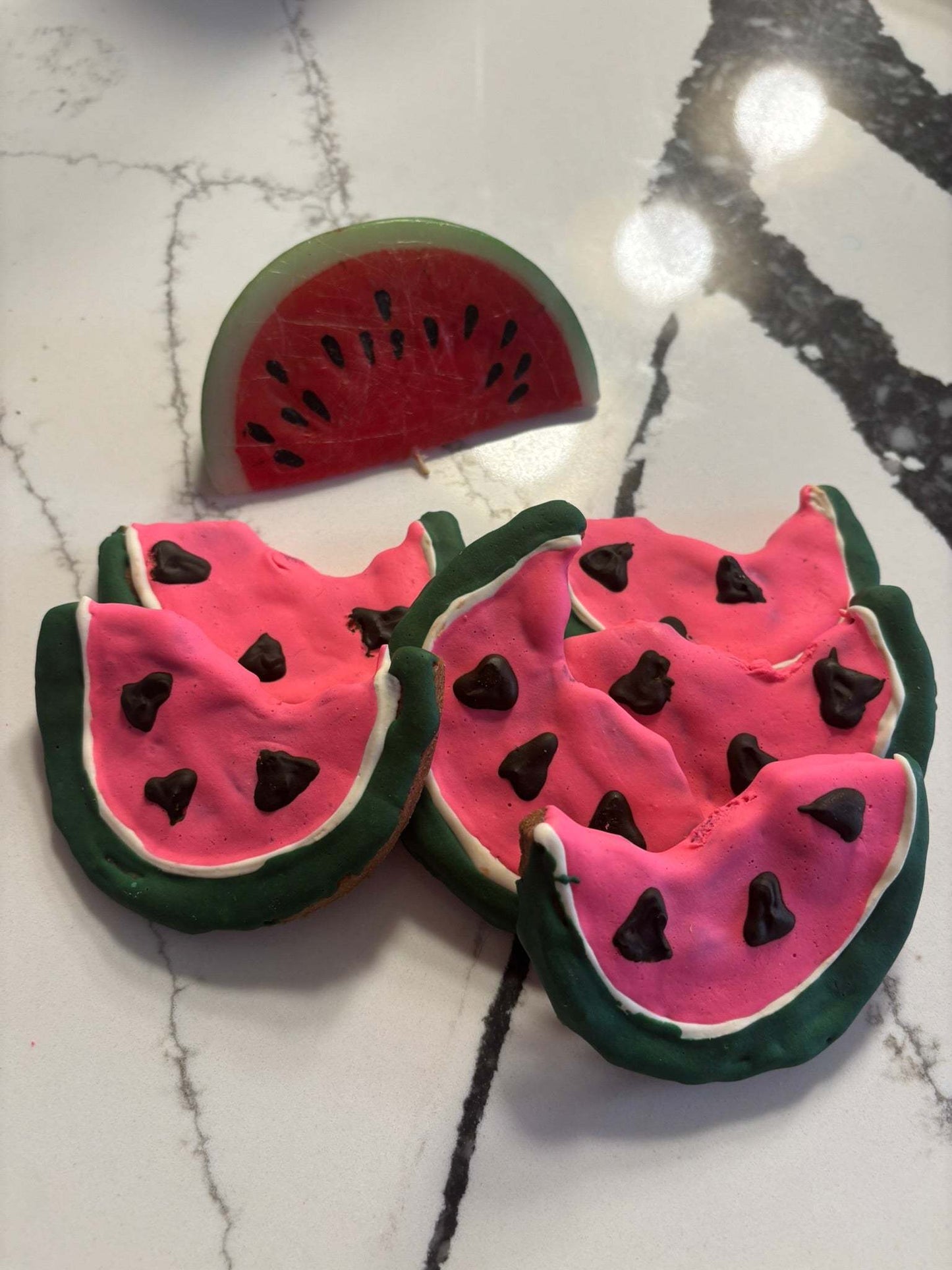 Organic Watermelon Dog Cookies shaped like watermelon slices with peanut butter flavor, made from all-natural, human-grade ingredients for healthy dog treats