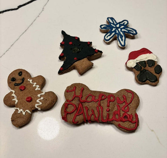 Christmas dog peanut butter cookies with festive shapes in a gift box