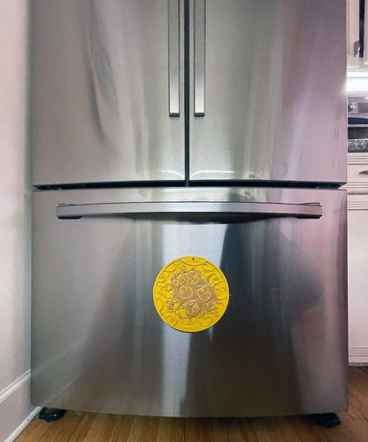 Yellow Rubber Duckies emat lick mat with suction cups attached to stainless steel refrigerator door
