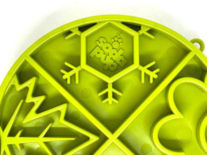 Close-up of green Four Seasons Design eTray shallow slow feeder dog bowl with raised ridges and seasonal patterns for enrichment