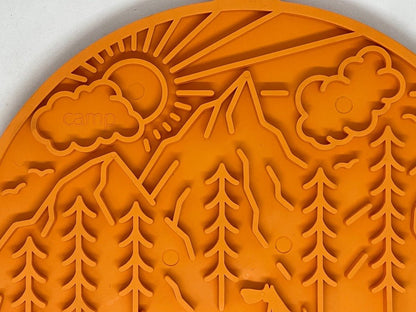 Orange Camp eMat dog lick mat with mountain and sun textured pattern, made in USA with suction cups for anxiety relief and grooming