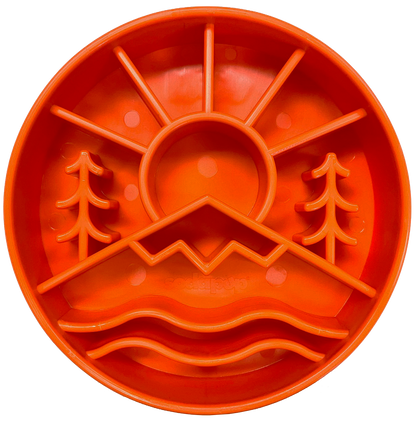 Orange Great Outdoors slow feeder dog bowl with raised ridges shaped like mountains and trees for mental enrichment and slow eating