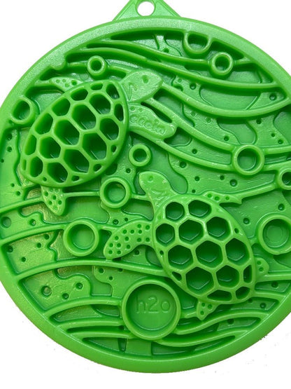 Green Water eCoin nylon dog enrichment Snacking Coin  with turtle motif and textured cavities for durable chewing and snacking