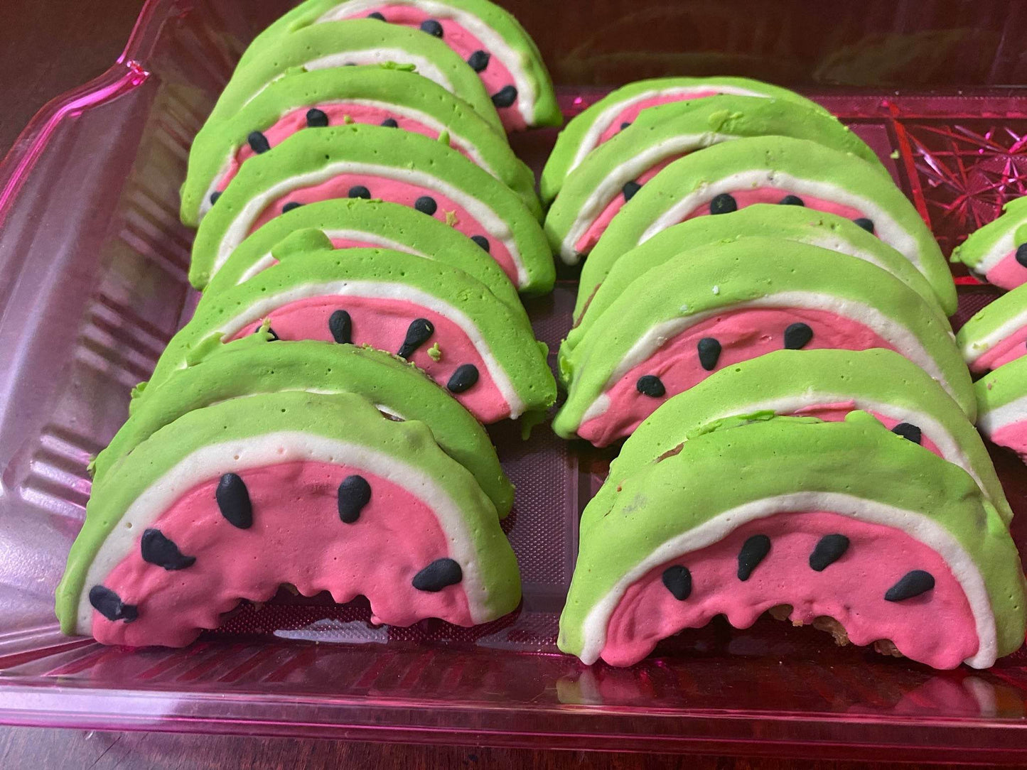 Organic watermelon-shaped dog cookies with peanut butter flavor, made with all-natural ingredients