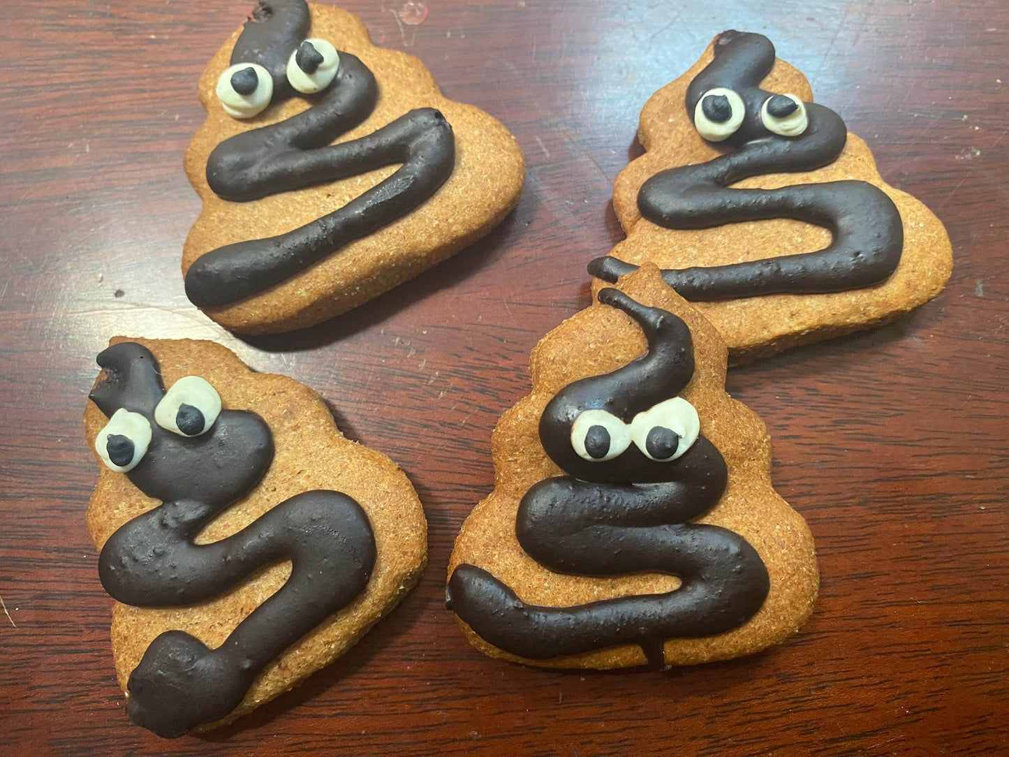 Poop Organic Dog Cookies shaped like poop emoji with peanut butter flavor and organic ingredients