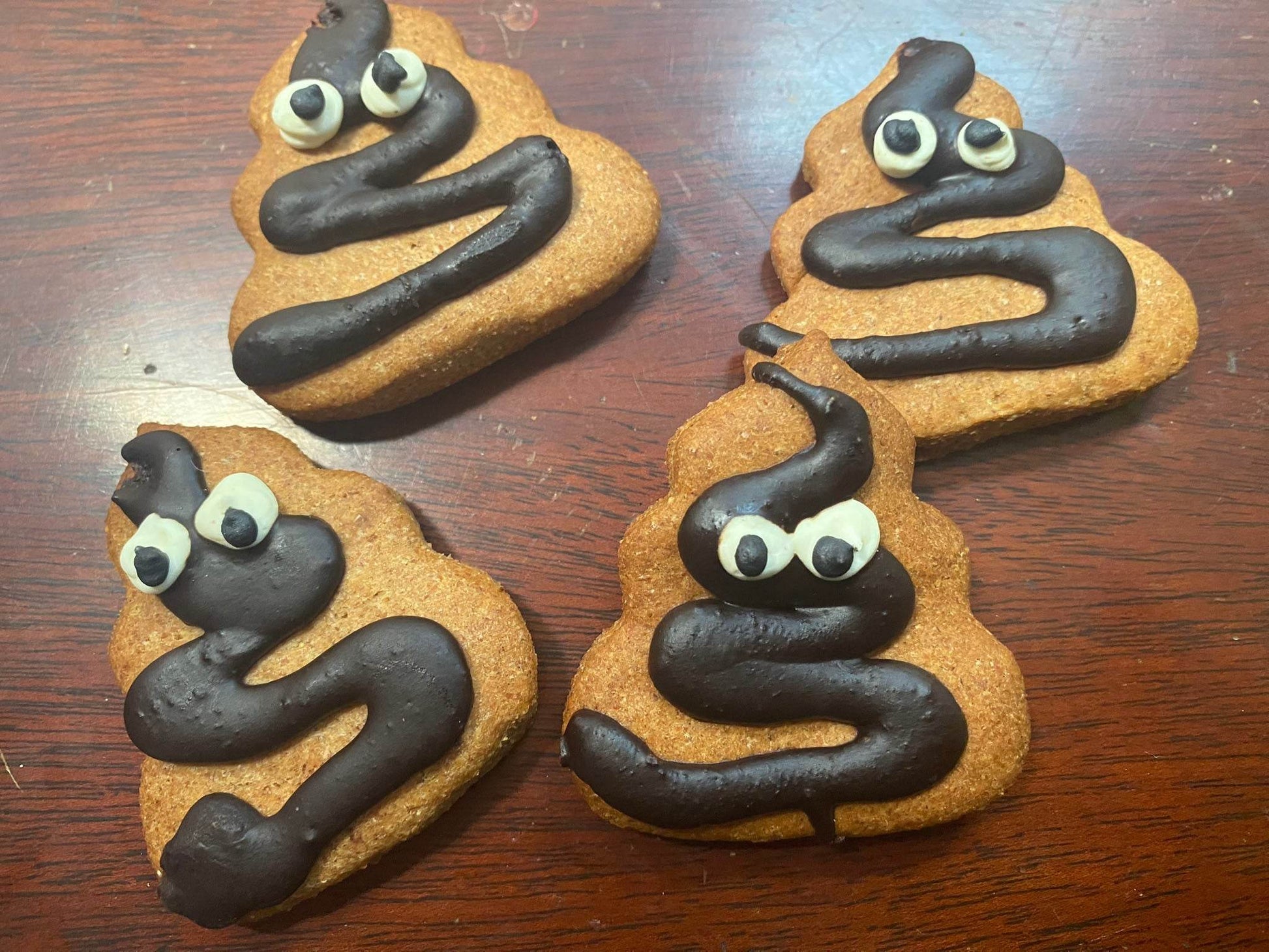 Poop Organic Dog Cookies shaped like poop emoji with peanut butter flavor and organic ingredients