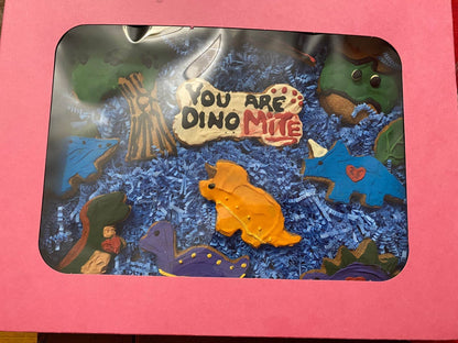 Dinosaurs Organic Dog Cookie Box with colorful dinosaur-shaped organic dog treats in a pink gift box