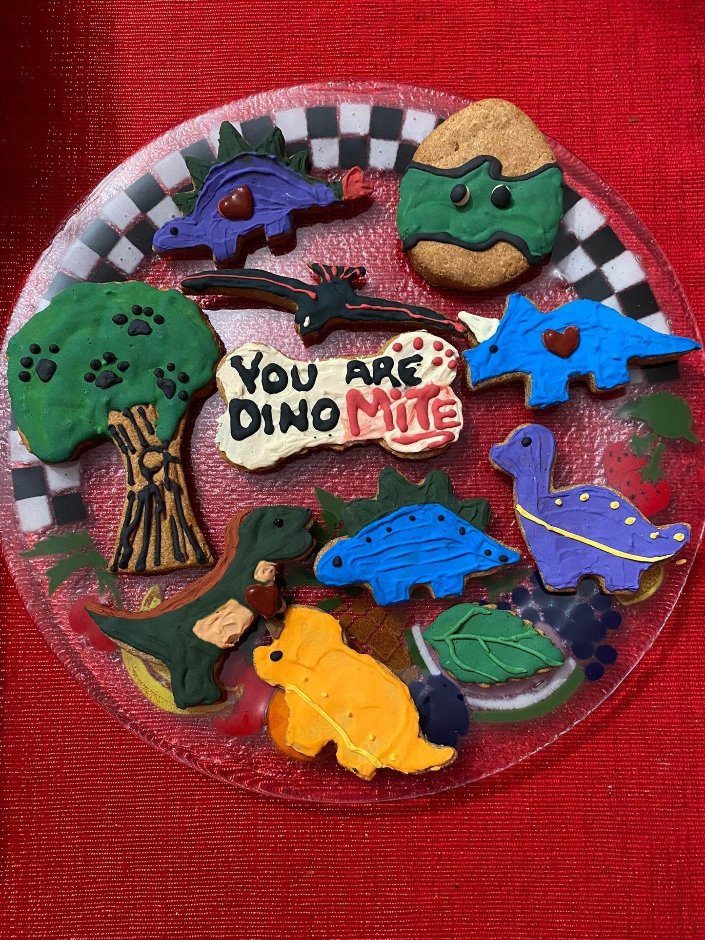 Dinosaurs Organic Dog Cookie Box with colorful dinosaur-shaped organic dog treats on a plate