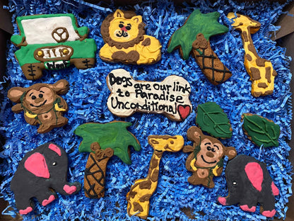 Safari Organic Dog Cookie Box with colorful safari animal-shaped peanut butter cookies on blue shredded paper