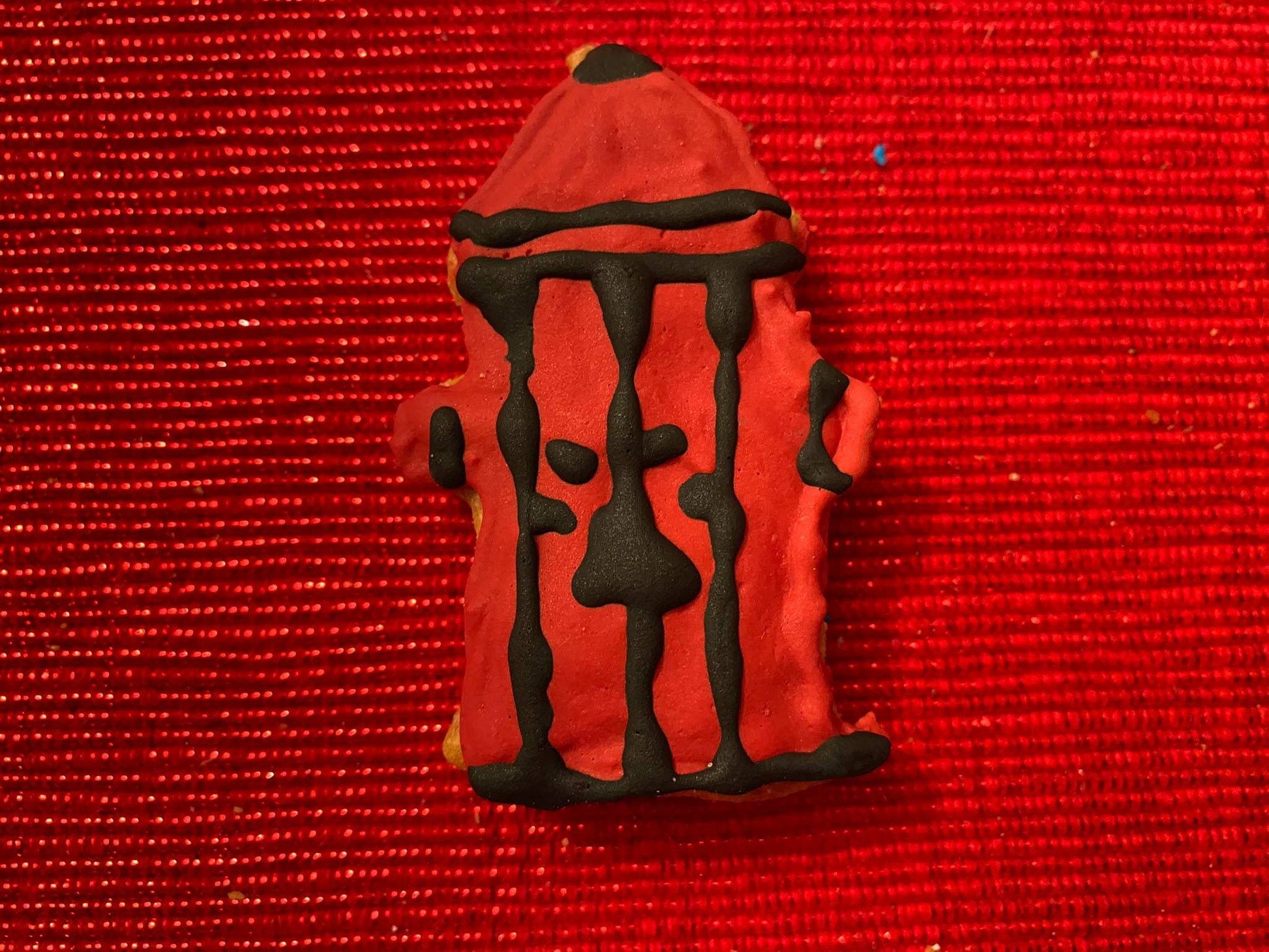 Dog Life Organic Dog Cookie Box red fire hydrant shaped dog cookie with black icing on red textured background