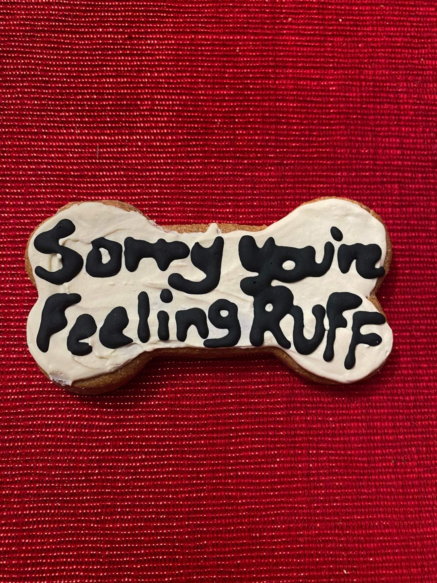 Get Well Organic Dog Cookie Box bone-shaped dog treat with "Sorry you're Feeling Ruff" text on white icing