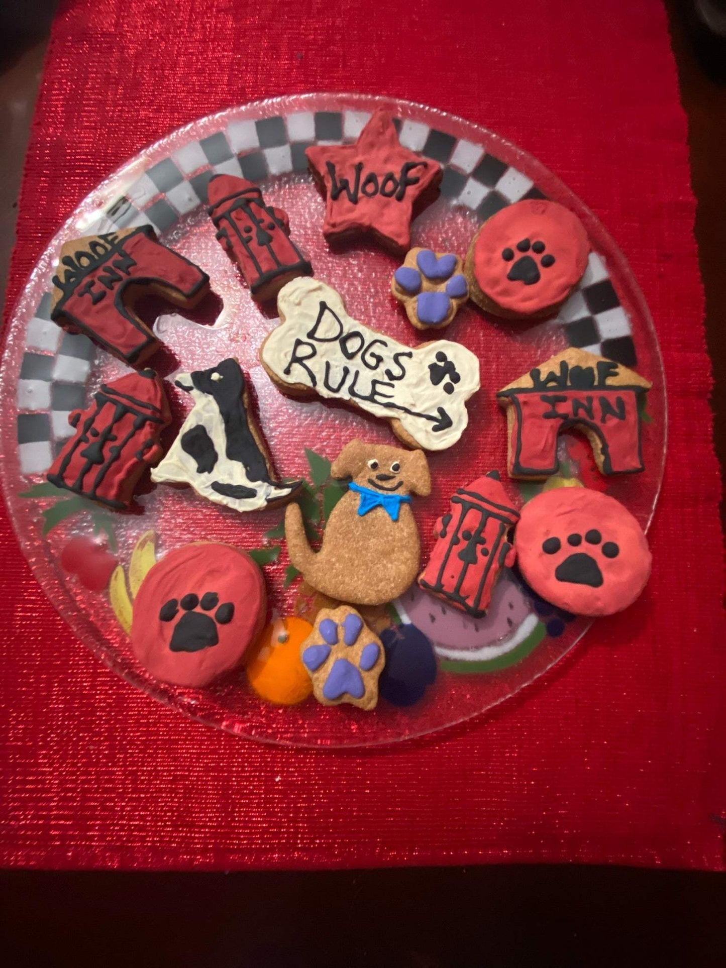 Get Well Organic Dog Cookie Box with assorted dog-themed organic peanut butter cookies including paws, doghouses, bone-shaped, and dog illustrations on a plate