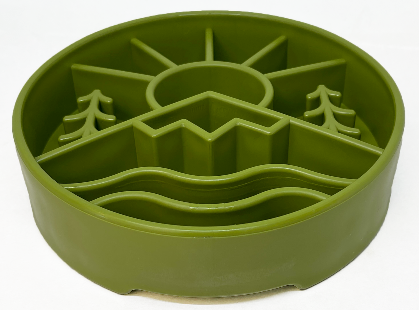 Green slow feeder dog bowl with raised ridges in outdoor nature design featuring sun, mountains, and trees for mental enrichment and slow eating