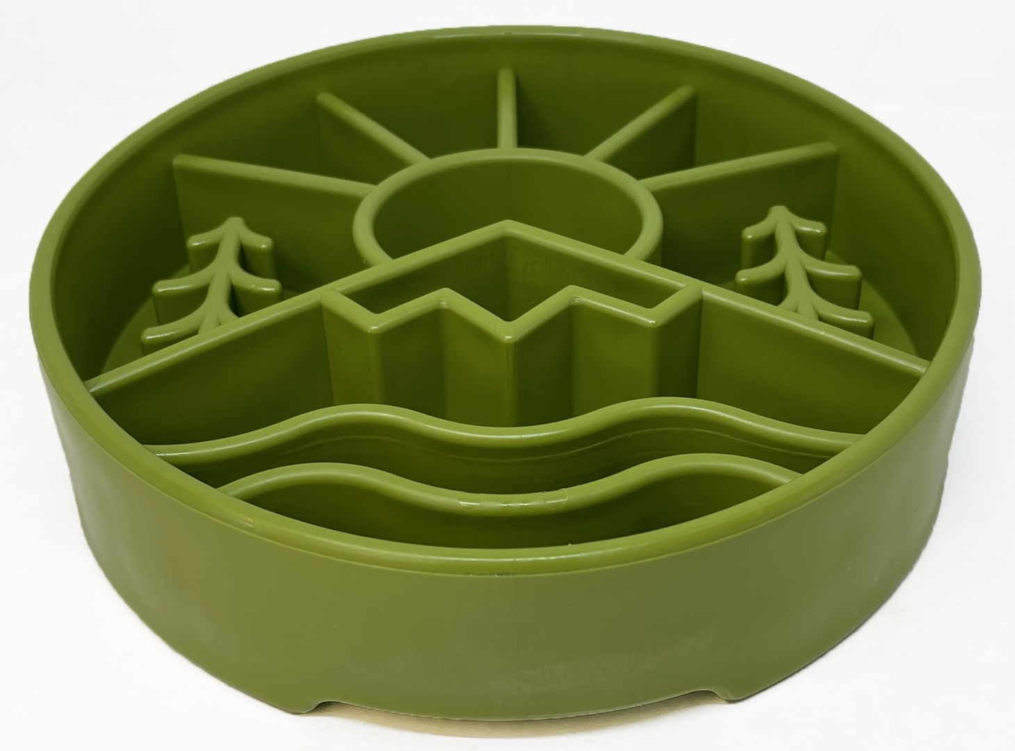 Green slow feeder dog bowl with raised ridges in outdoor nature design featuring sun, mountains, and trees for mental enrichment and slow eating