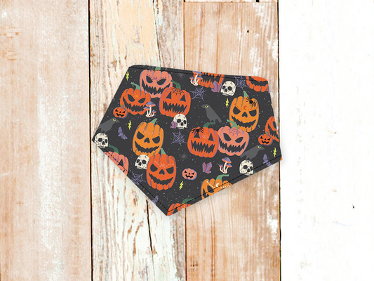 Jackolanterns dog bandana with adjustable snap closures and festive pumpkin print on white flannel backing