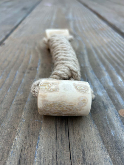 eco-friendly hemp rope and coffee wood interactive dog toy on wooden surface
