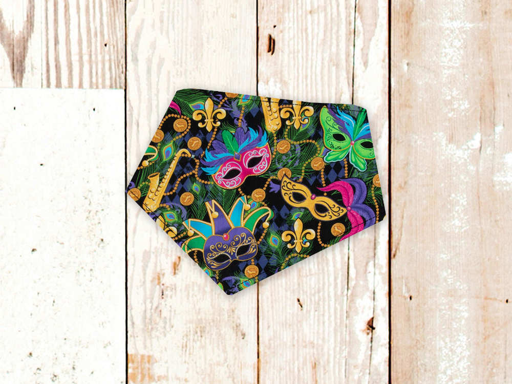 Mardi Gras Masks dog bandana with colorful mask and fleur-de-lis print, adjustable snap closures, and white flannel backing for durability