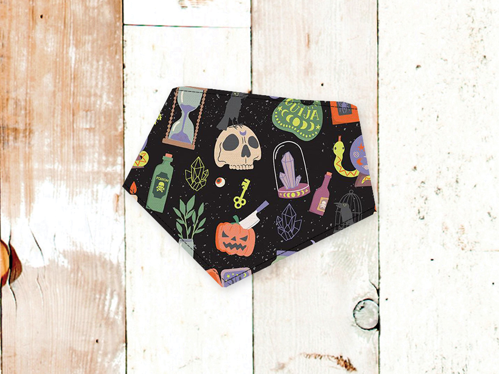 Black mystical themed dog bandana with adjustable snap closures and white flannel backing for a comfortable fit and durability.