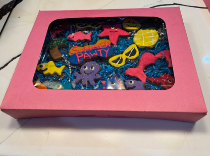 PAWaquarium Dog Cookie Box with colorful organic ocean-themed dog cookies in a pink gift box