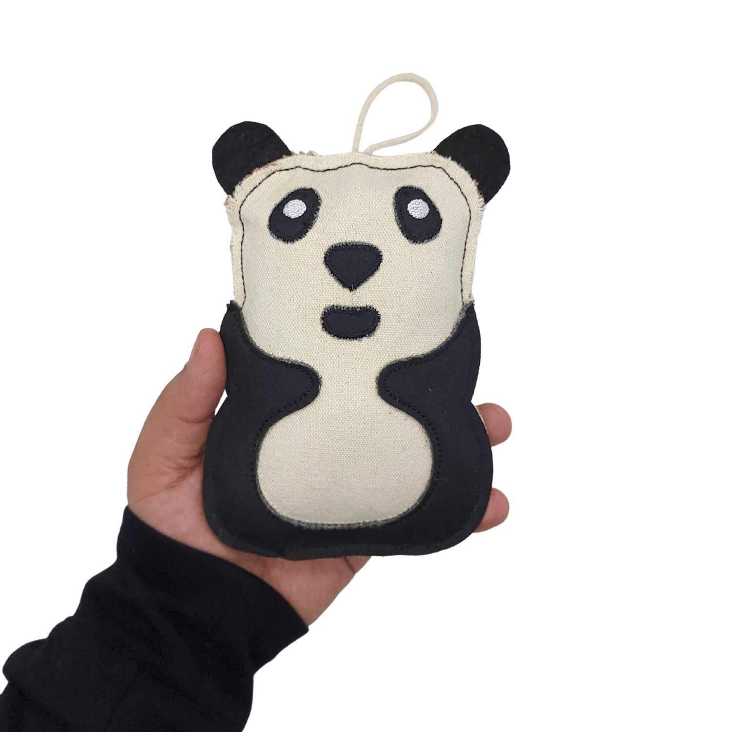Hand holding Canvas & Jute Panda-Shaped Dog Chew Toy made from natural fibers and durable materials