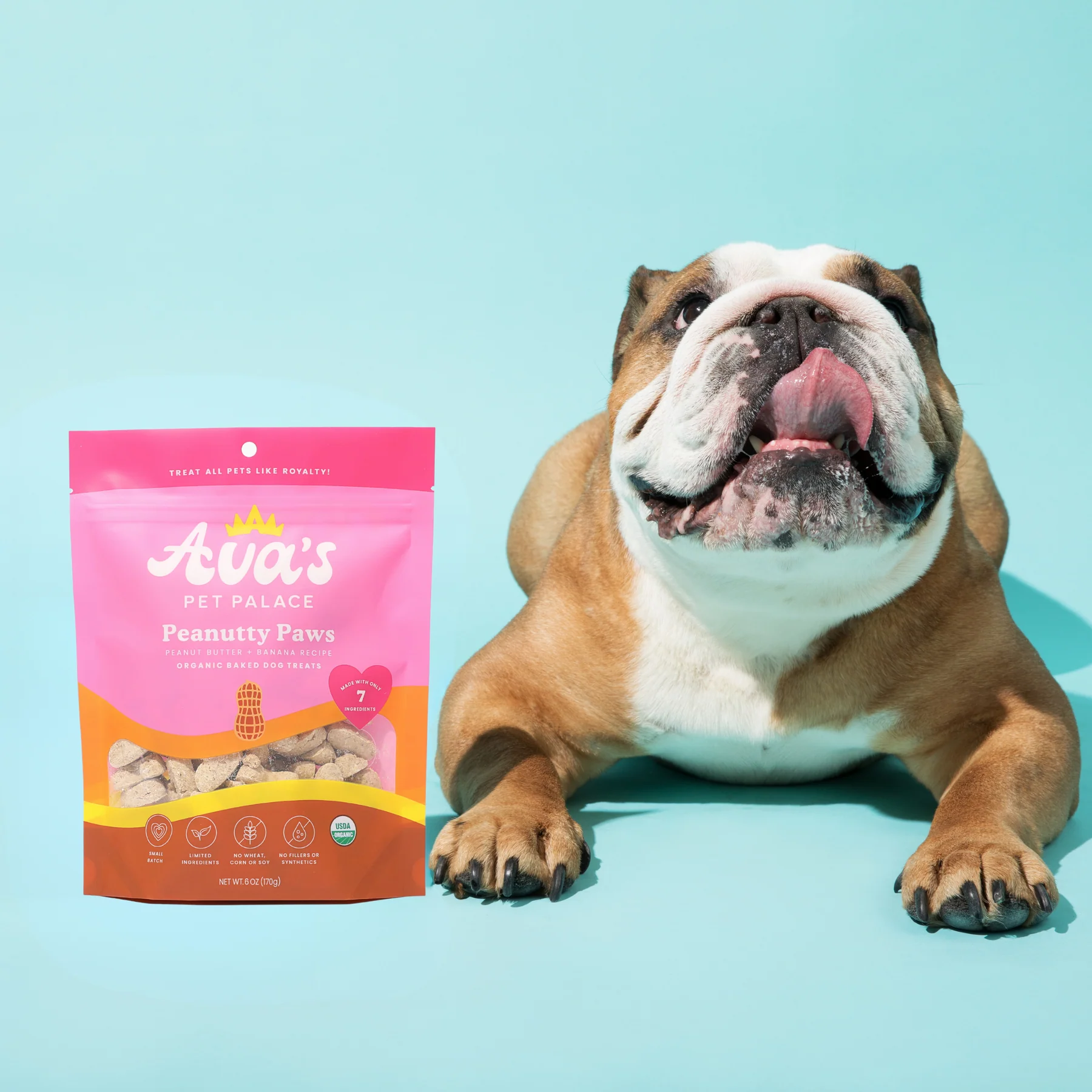 Ava's Pet Palace organic peanut butter dog treats with a happy bulldog on blue background