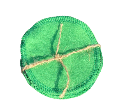 Reusable green cotton pads tied with natural twine for eco-friendly pet grooming and cleaning
