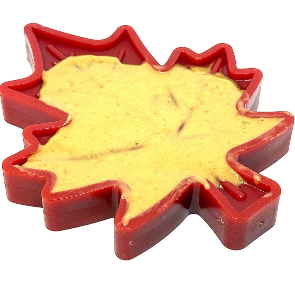 Canadian Maple Leaf shaped green nylon dog chew toy with textured surface for treats and enrichment