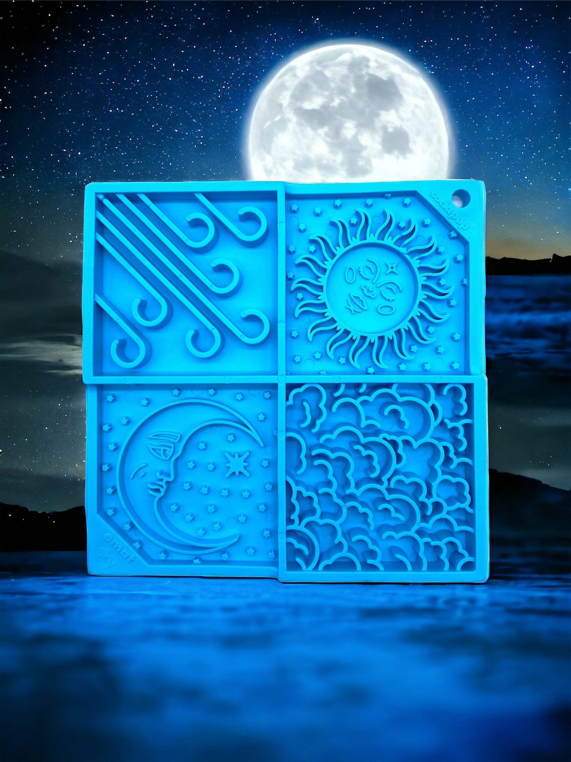 Blue Sky eMat enrichment lick mat for dogs and cats with celestial sun, moon, cloud, and star patterns