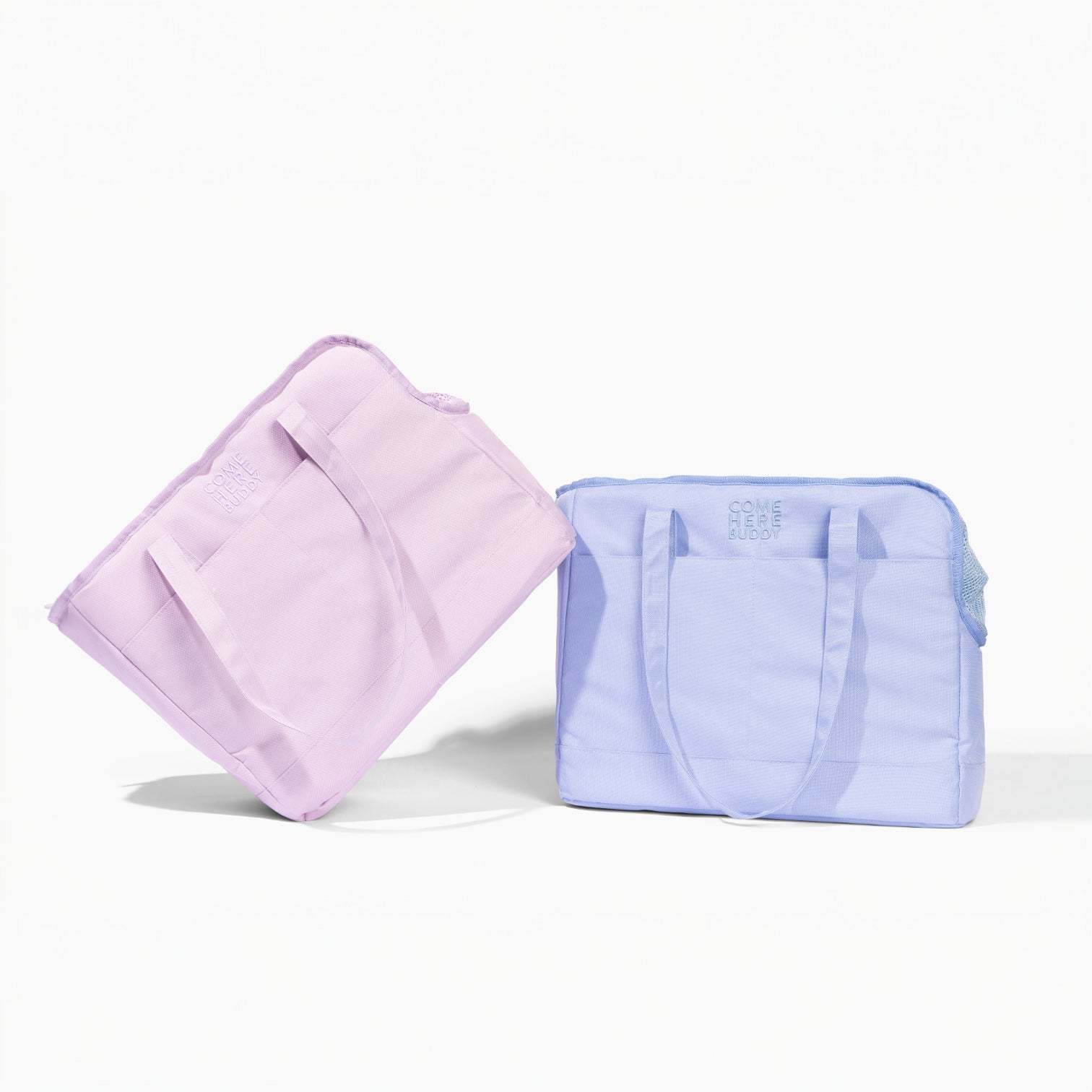 Come Here Buddy Pet Tote Bag in pastel purple and blue, lightweight dog carrier with multiple pockets and sherpa pad, eco-friendly recycled polyester design