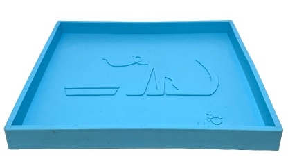Blue silicone dog lick mat with raised edges and embossed dog and bowl design