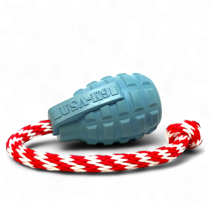 USA-K9 Grenade steel blue rubber dog toy with textured grooves and red-white tug rope for heavy chewers