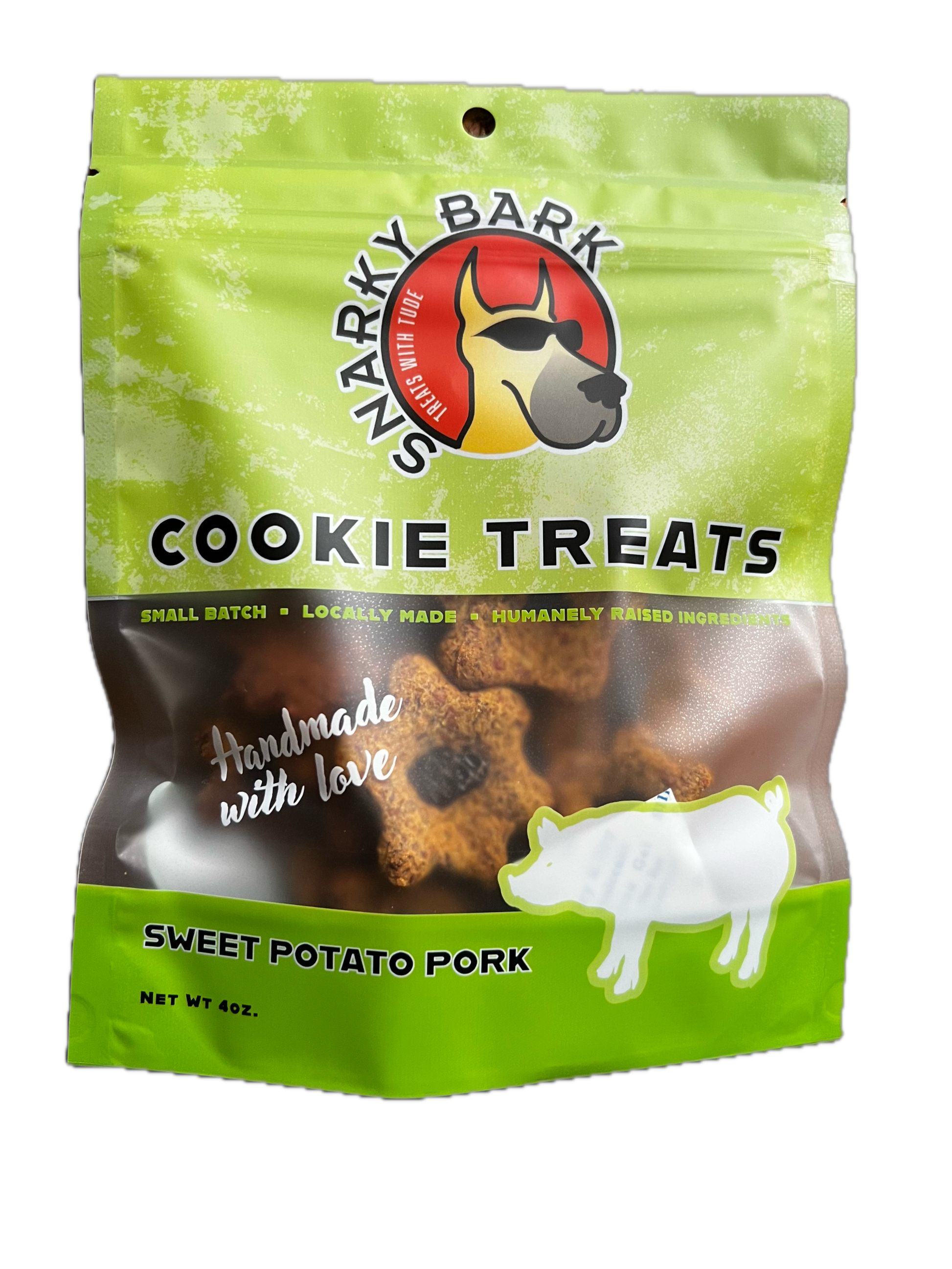 Snarky Bark sweet potato pork dog cookie treats in green BPA free packaging, made with local, grass-fed pork and pesticide-free sweet potatoes