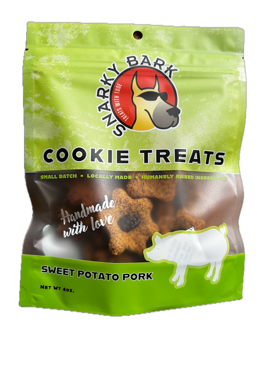 Snarky Bark sweet potato pork dog cookie treats in green BPA free packaging, made with local, grass-fed pork and pesticide-free sweet potatoes