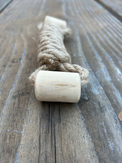 eco-friendly hemp rope and coffee wood interactive dog toy on wooden surface