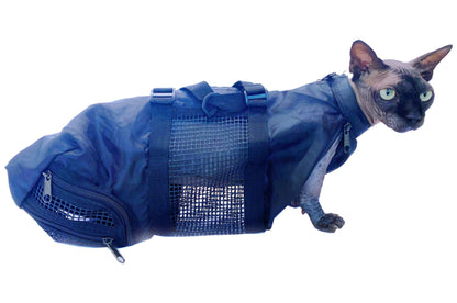 Sphinx cat wearing black Cat or Dog Grooming Bag with mesh panels and zippers for grooming access