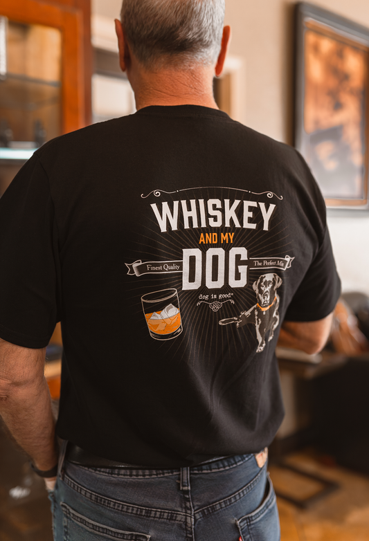 Man wearing black "Whiskey and My Dog" T-shirt with whiskey glass and dog illustration on back