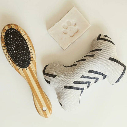 Two-sided pet brush with bamboo handle featuring bristle and wire sides for shedding and detangling pets