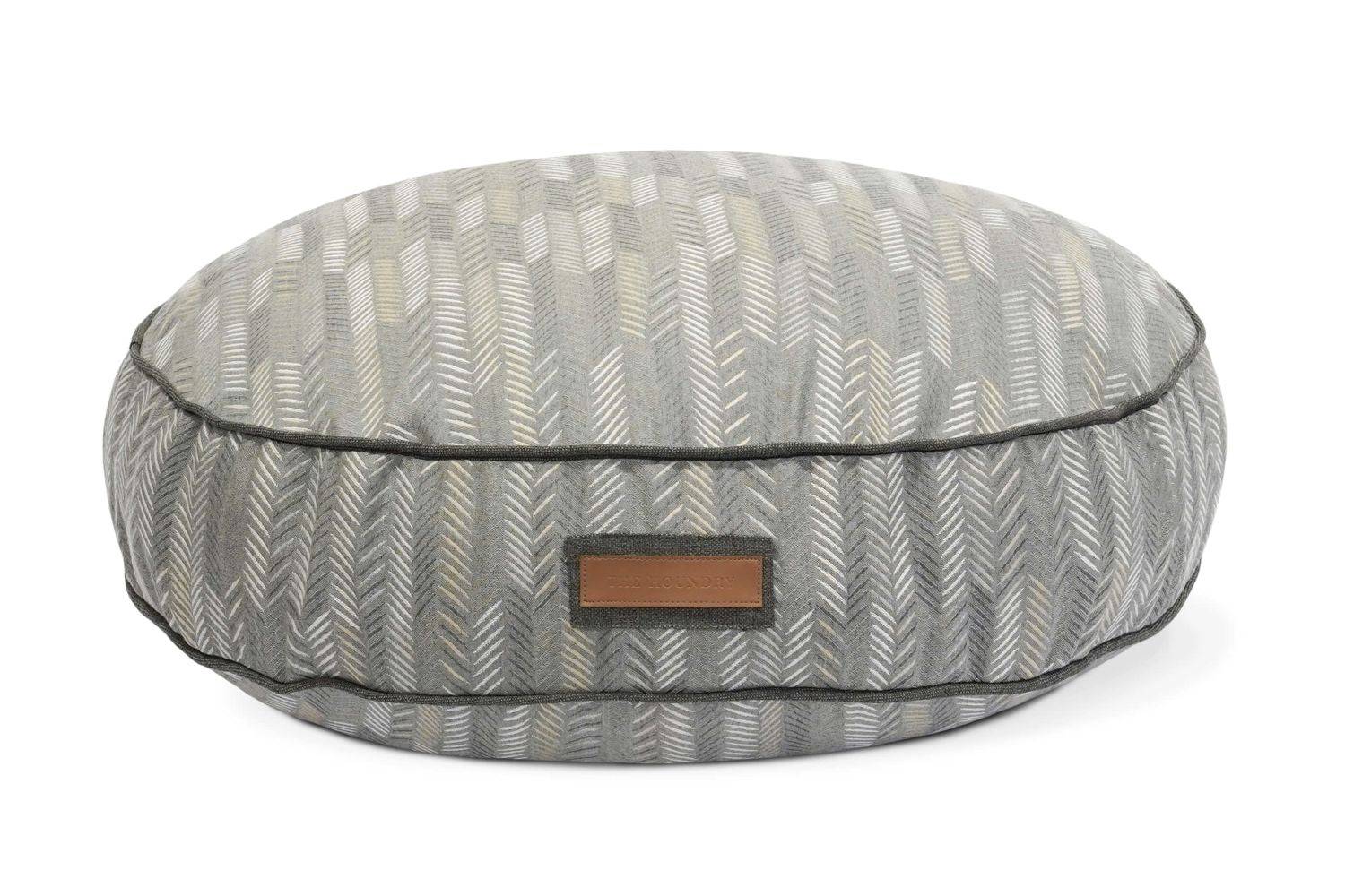Round gray chevron patterned plush pet bed made from recycled materials, durable and washable.