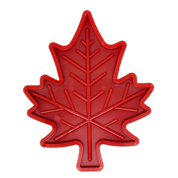 Red Canadian Maple Leaf shaped indestructible nylon dog chew toy with textured surface for power chewers