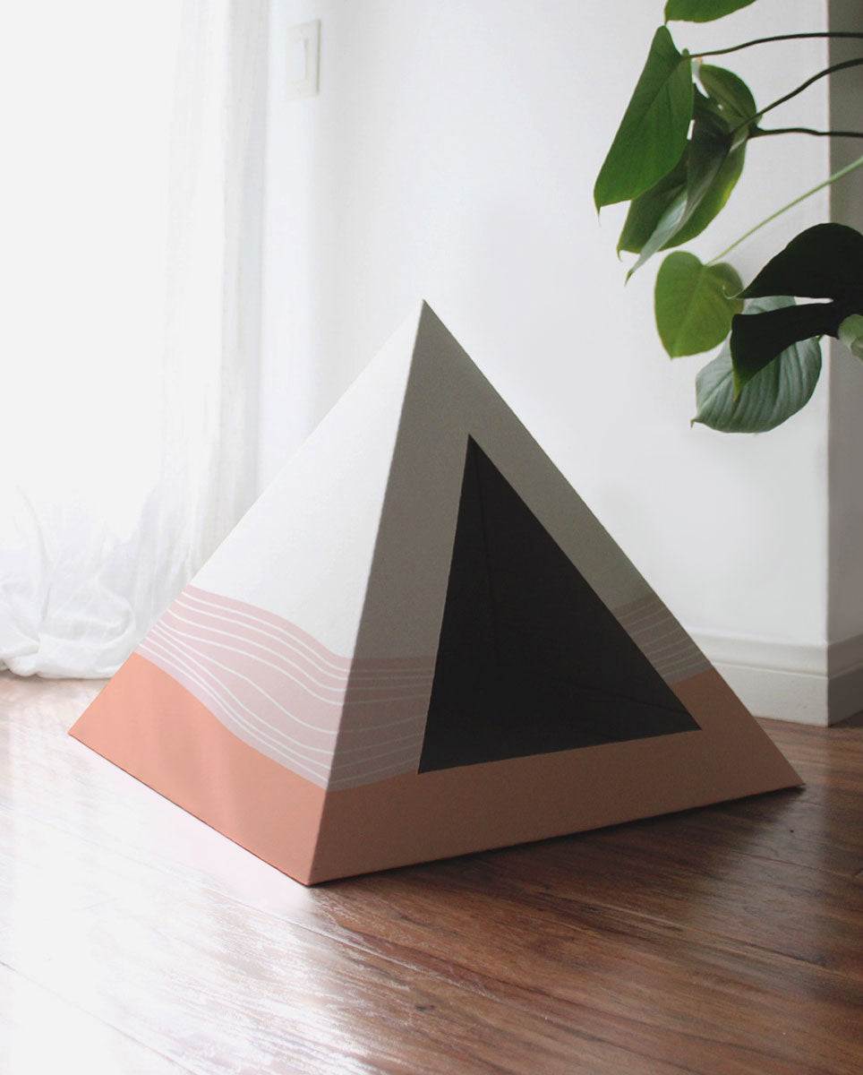 Wavey cardboard cat pyramid with modern wave design, eco-friendly and cozy cat hideaway