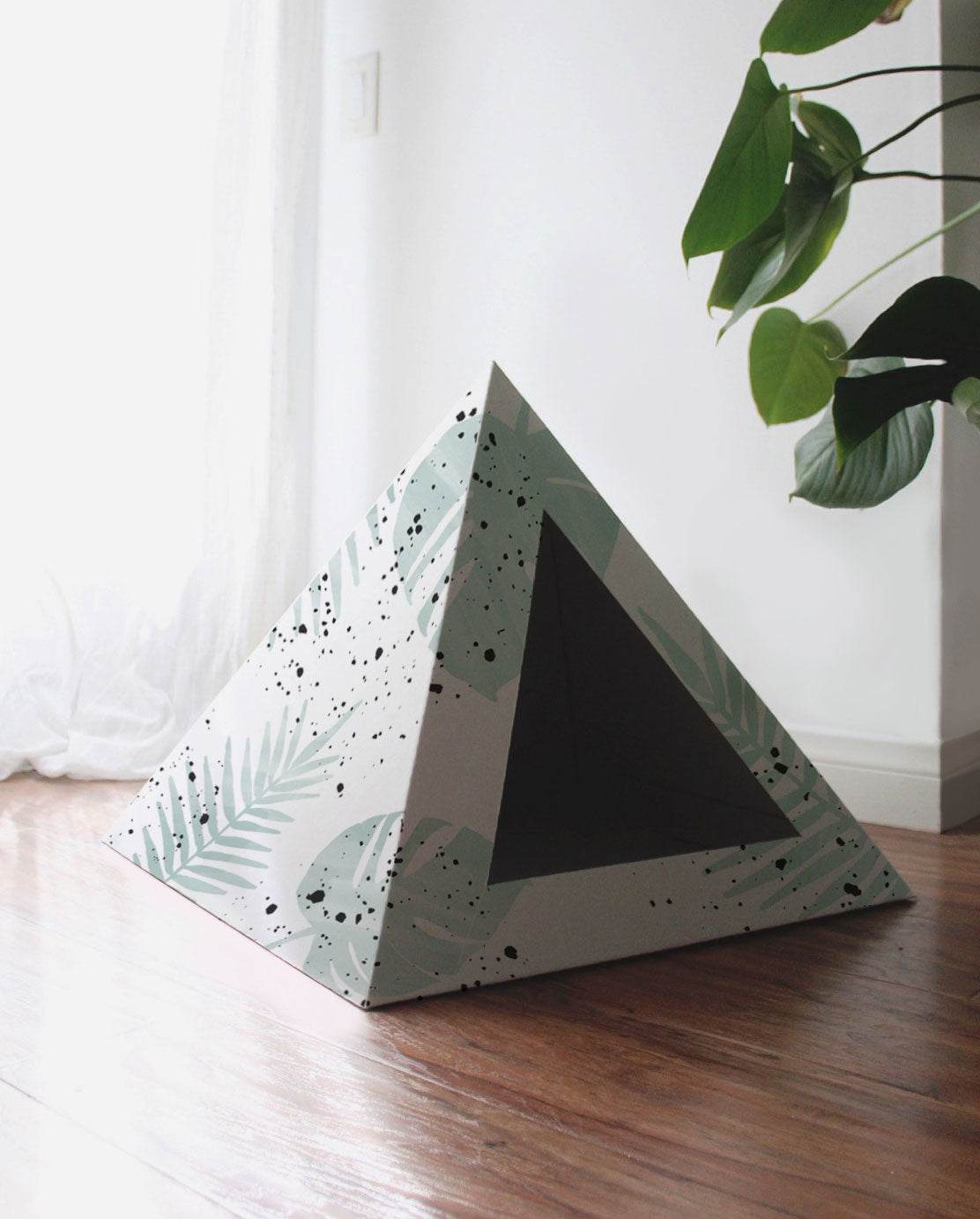 Oasis Cardboard Cat Pyramid with modern leaf design, cozy cat hideaway made from recycled cardboard