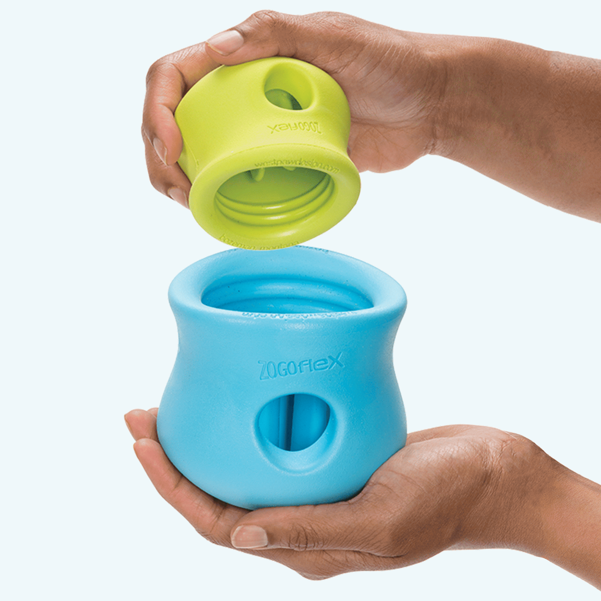 customizable puzzle and treat toy with blue and green durable rubber compartments designed for interactive dog feeding