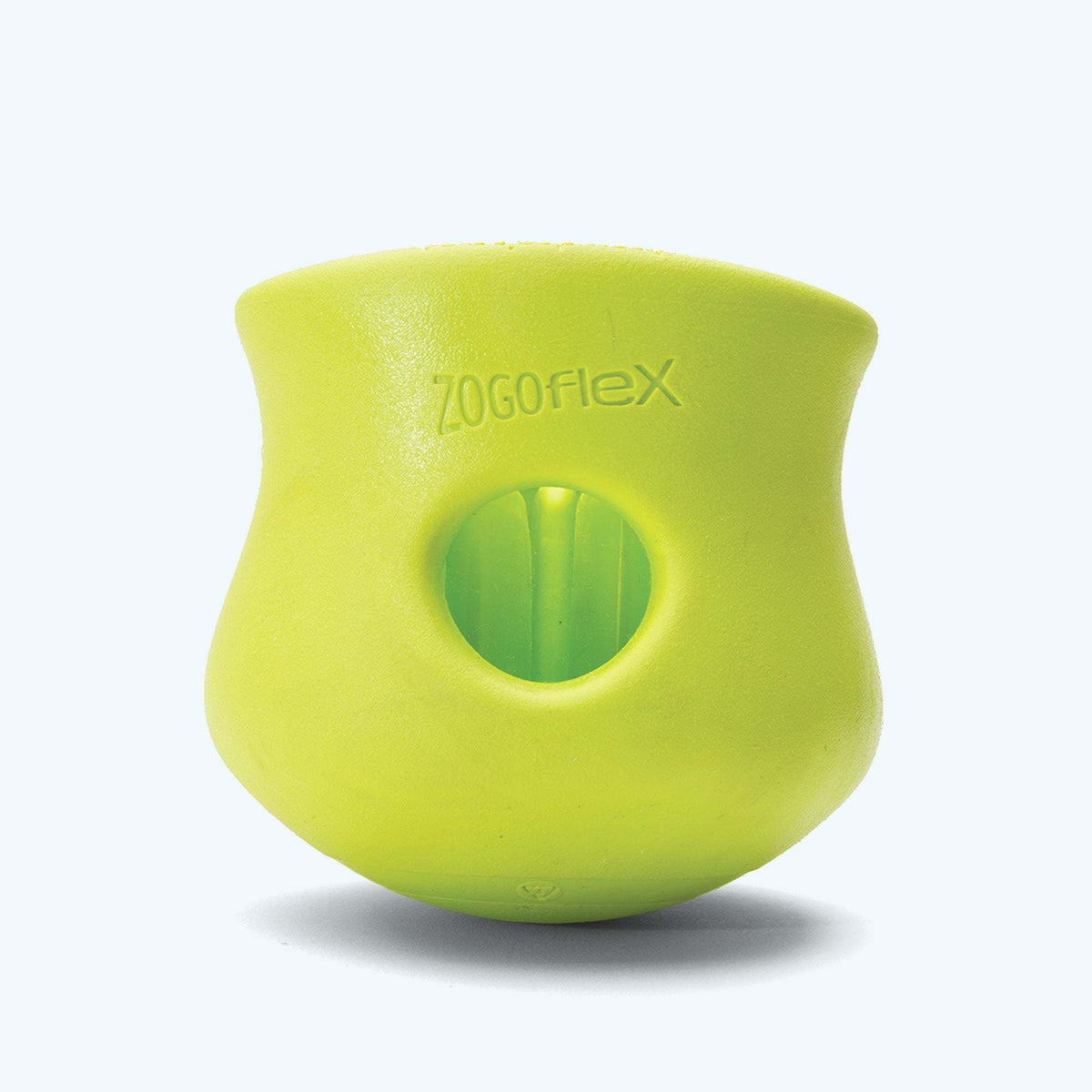 Green durable rubber customizable puzzle and treat toy for dogs with a hollow center and flexible design