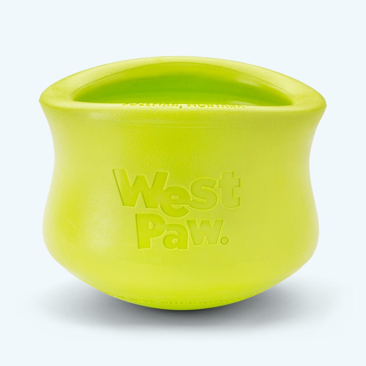 Customizable puzzle and treat toy in bright lime green durable rubber with West Paw logo embossed, designed for dogs